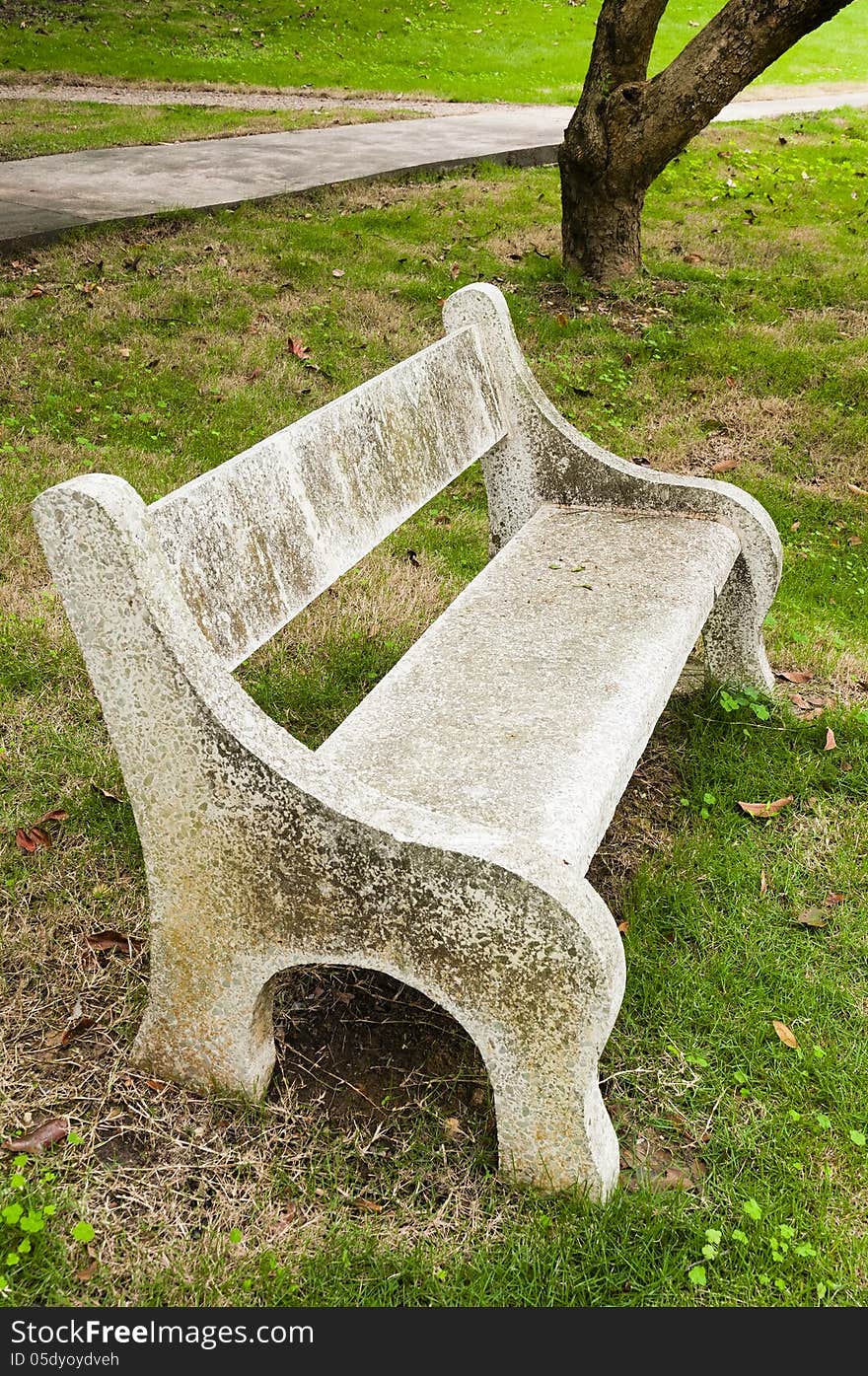 Stone   chair  in  the   garden. Stone   chair  in  the   garden