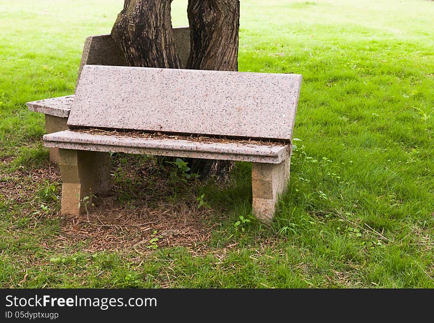 Stone   chair  in  the   garden. Stone   chair  in  the   garden