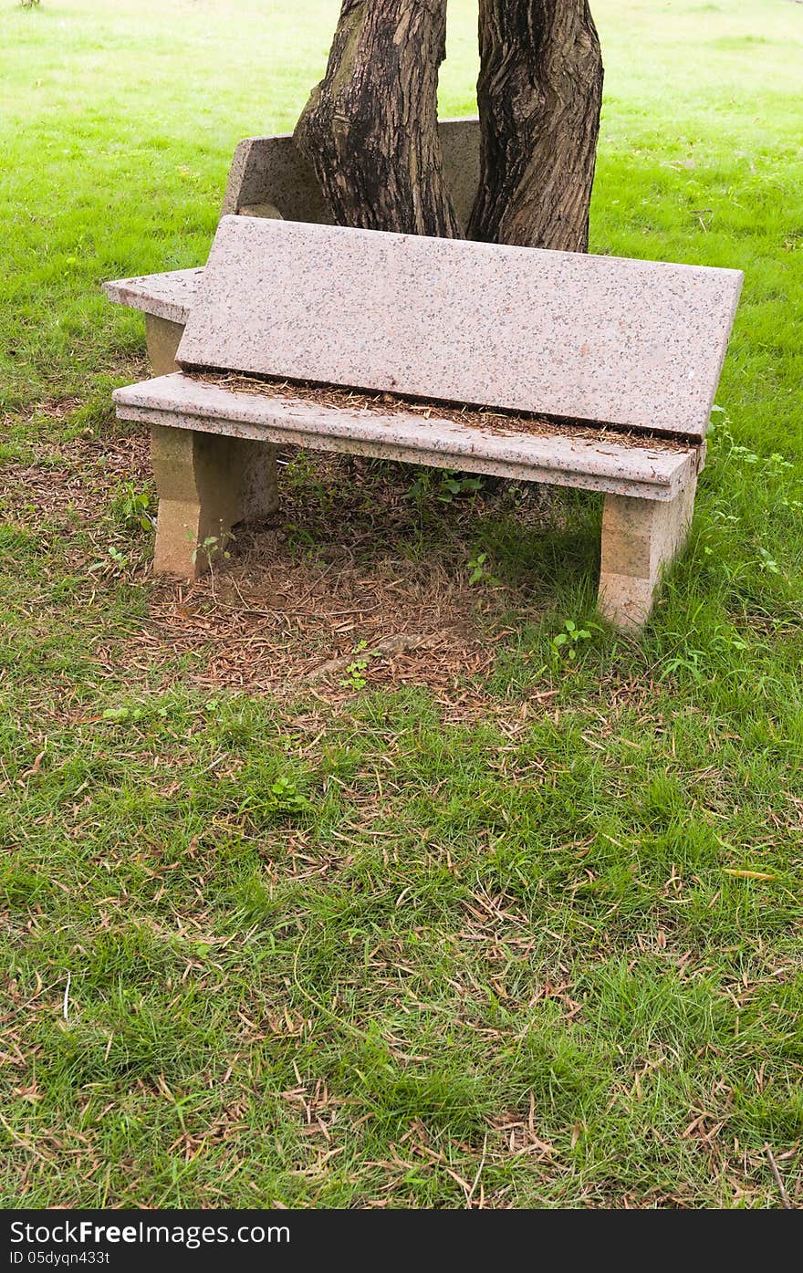 Stone   chair  in  the   garden. Stone   chair  in  the   garden