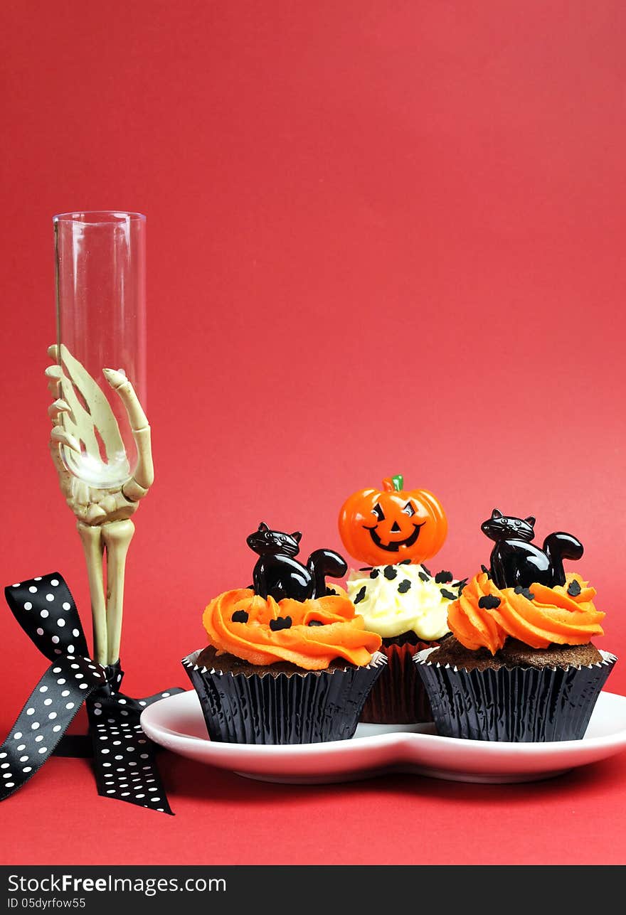 Happy Halloween party food with skeleton hand glass on red background. Happy Halloween party food with skeleton hand glass on red background.