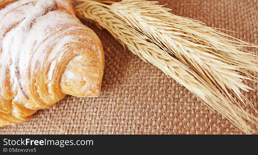 Pasty croissant on the green background