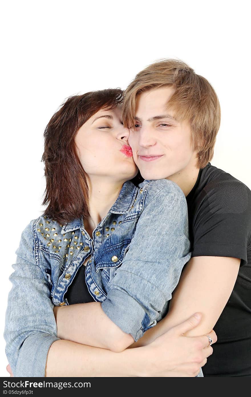 Young love couple kissing over white background, valentine day concept. Young love couple kissing over white background, valentine day concept