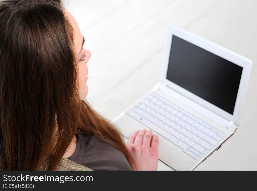 Young business girl with a notebook in hand in the office