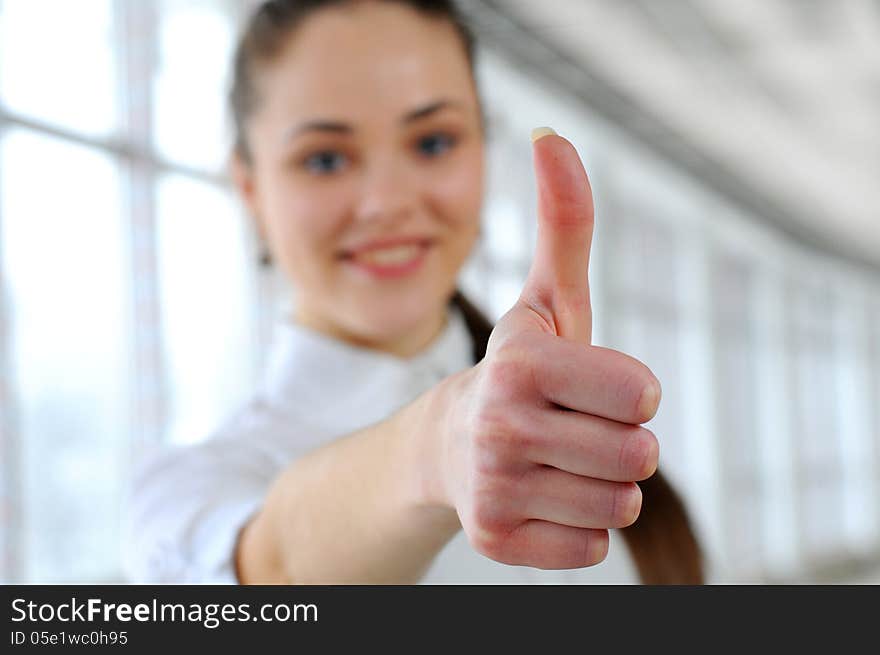 A portrait of a young business woman in an office. A portrait of a young business woman in an office