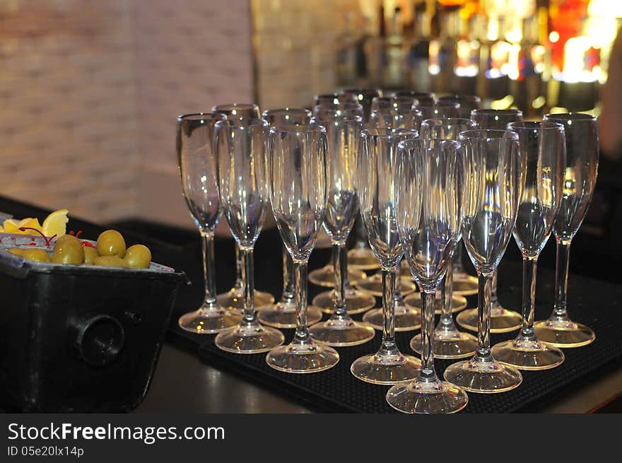 Champagne glasses on the bar ready for the party