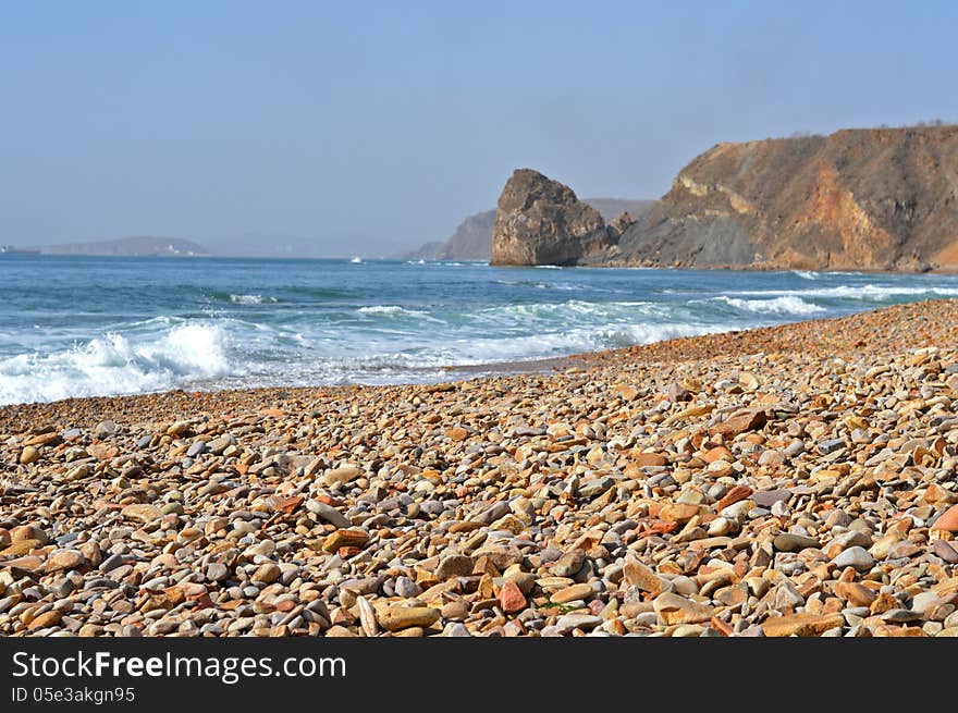 Stone seashore in the bright sunny day