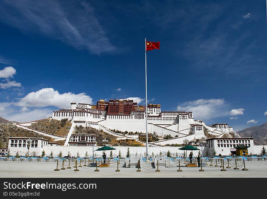 Potala Palace in Lhasa, Tibet. The Chinese flag in the foreground is like a symbol for the current development.