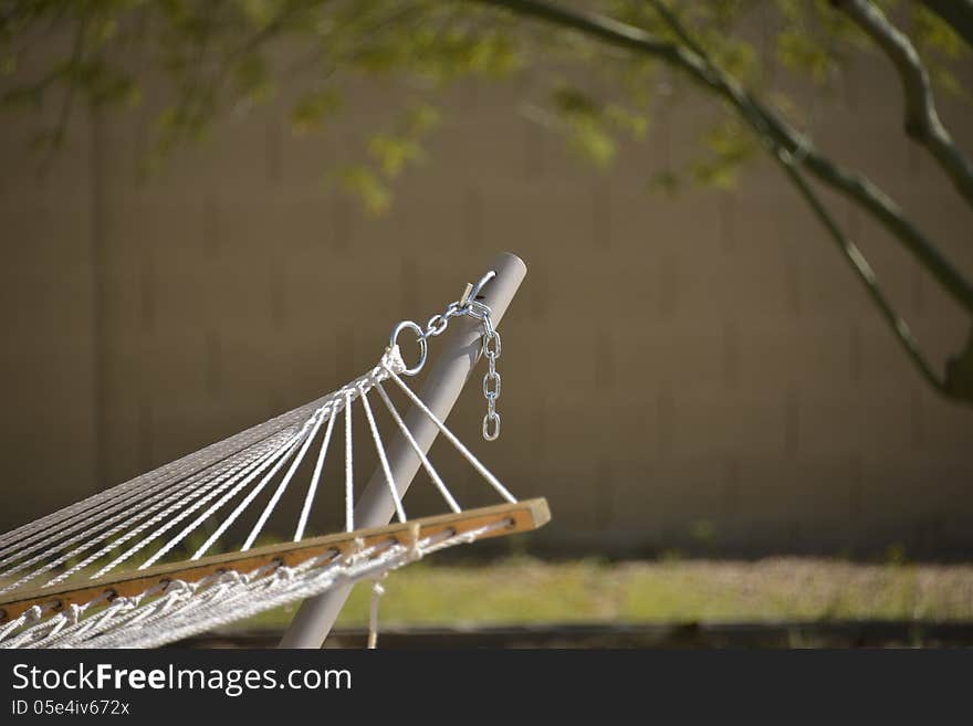 Hammock in the garden waiting for someone to get into it and rest