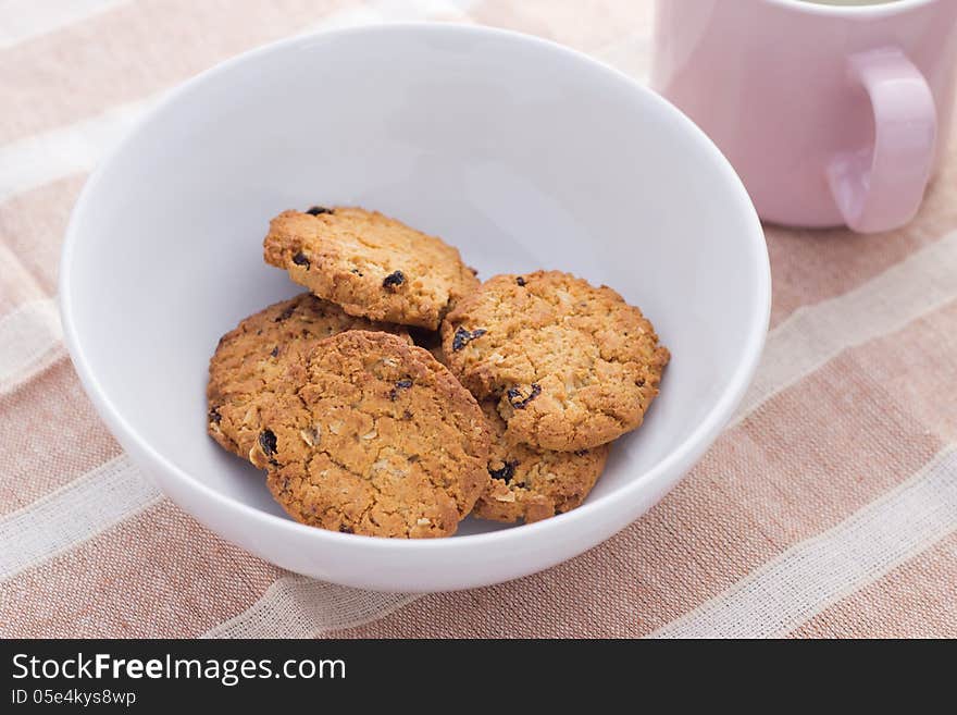 Home made chocolate chip cookies on a white plate