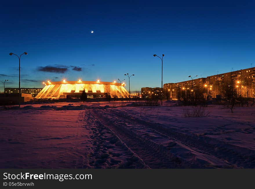 Palace of ice sports, house arena of hockey club sputnik in the winter at night. March 2013 in Nizhny Tagil, Russia. Palace of ice sports, house arena of hockey club sputnik in the winter at night. March 2013 in Nizhny Tagil, Russia.