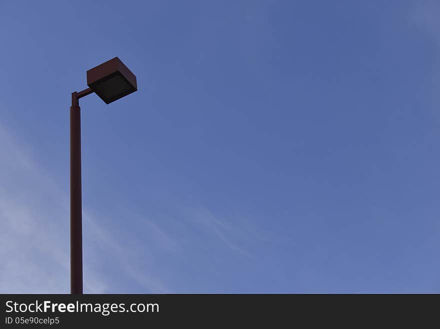 Street light before dusk falls on. Street light before dusk falls on