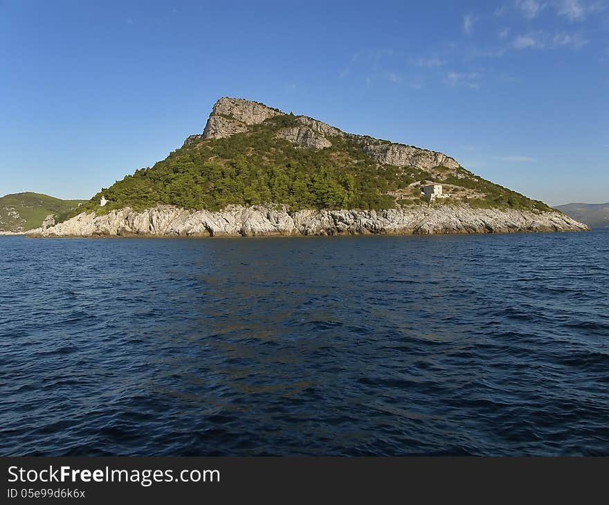 Viiew on a small lonely island (Elafiti) near Dubrovnik. Horizontal color photo. Viiew on a small lonely island (Elafiti) near Dubrovnik. Horizontal color photo.