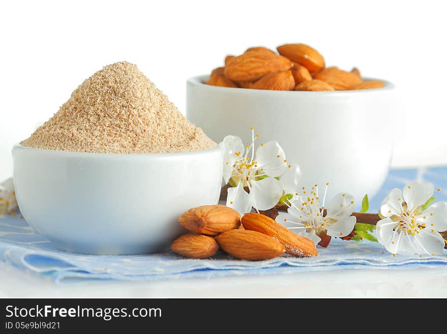 Almond flour and nuts on blue napkin