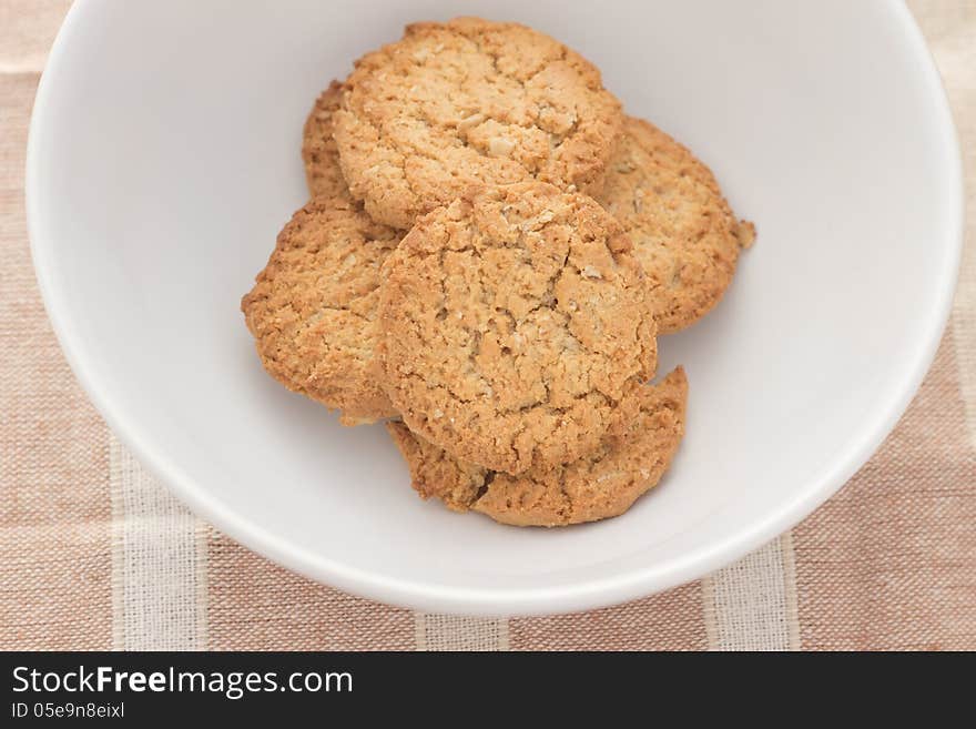 Home made chocolate chip cookies on a white plate. Home made chocolate chip cookies on a white plate.