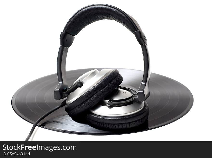 Vinyl record and headphones. Vinyl record and headphones.