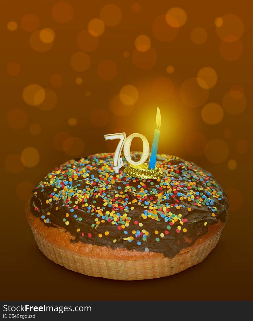 Seventy birthday cake on brown background. Seventy birthday cake on brown background