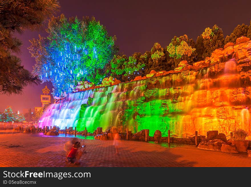 The image taken in china`s hebei province,qinhuangdao city,beidaihe district.At night colored lights illuminate the falls and create a charming turn away from. The image taken in china`s hebei province,qinhuangdao city,beidaihe district.At night colored lights illuminate the falls and create a charming turn away from.