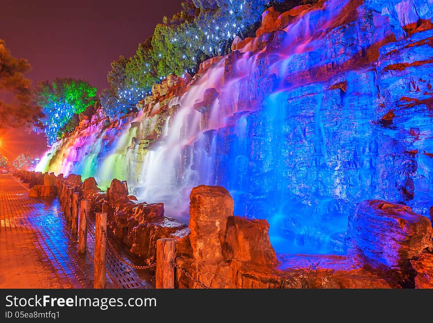 The image taken in china`s hebei province,qinhuangdao city,beidaihe district.At night colored lights illuminate the falls and create a charming turn away from. The image taken in china`s hebei province,qinhuangdao city,beidaihe district.At night colored lights illuminate the falls and create a charming turn away from.