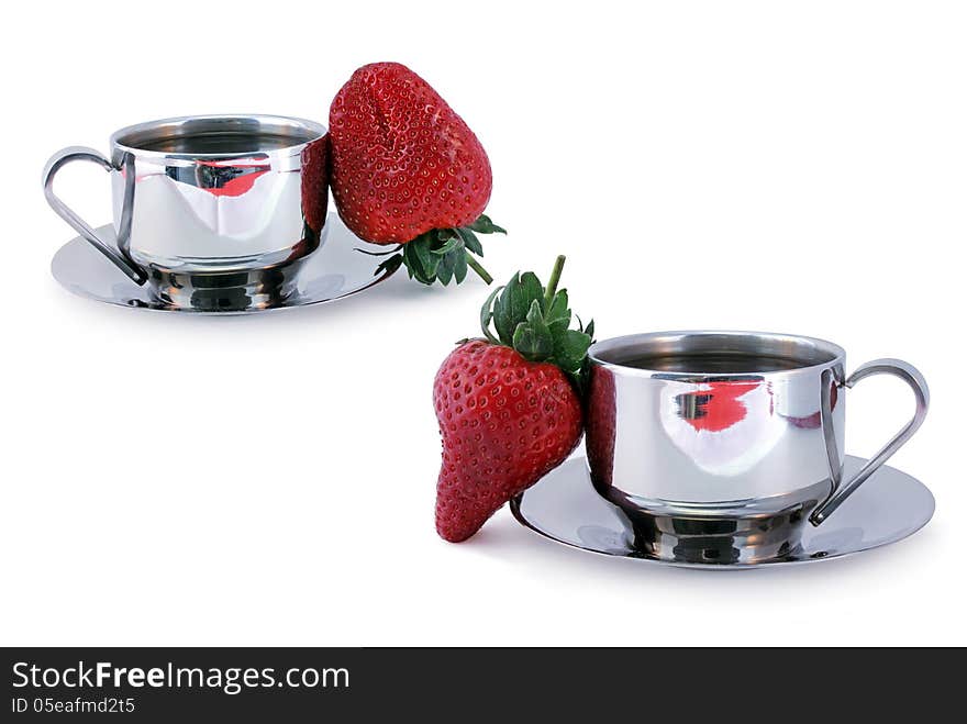 Two cups of coffee and fresh sweet strawberry against white background. Two cups of coffee and fresh sweet strawberry against white background.