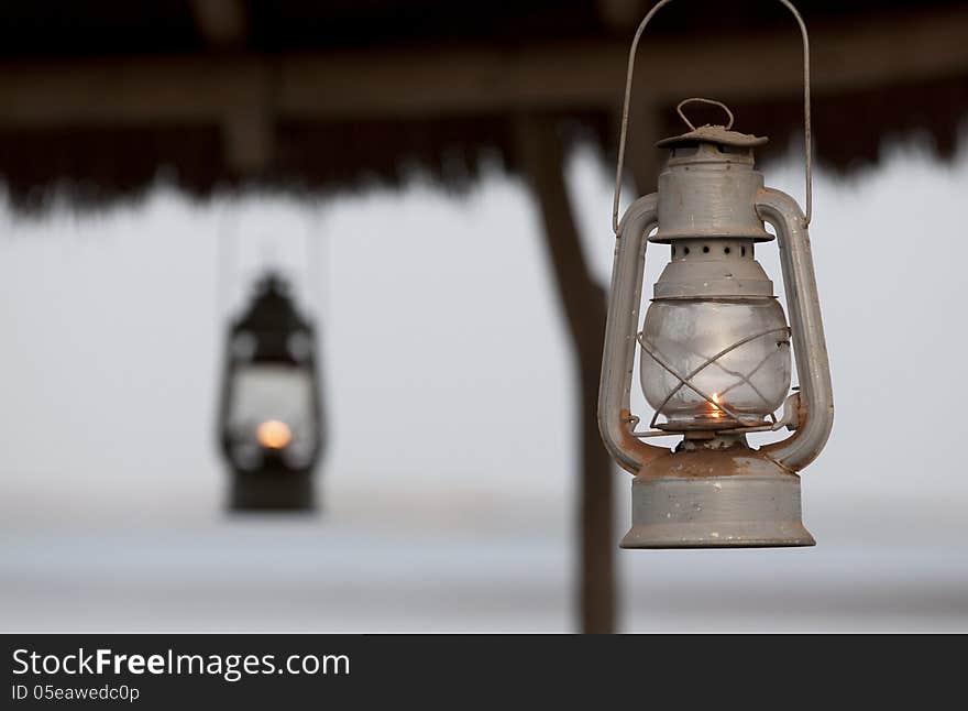 Metallic lanterns lighted, hang up to a roof. Metallic lanterns lighted, hang up to a roof.