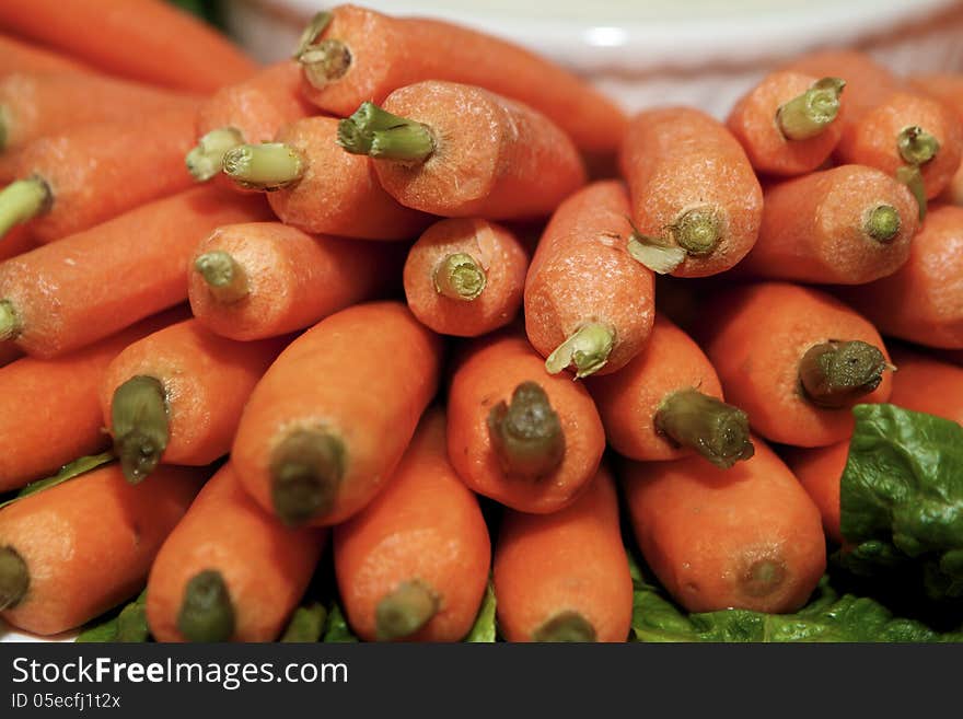 Close-up of piled fresh, orange carrots. Close-up of piled fresh, orange carrots.