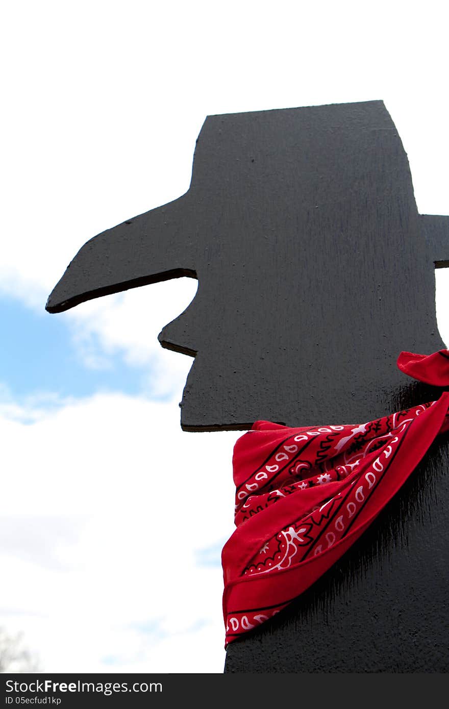 Black silhouette of cowboy with red bandana