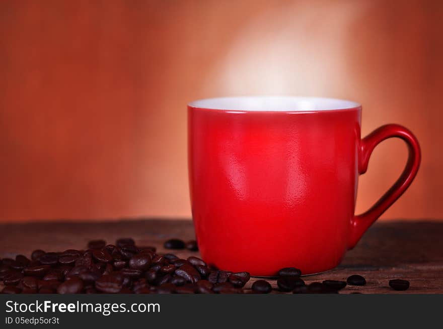 Close up red cup coffee on wood background