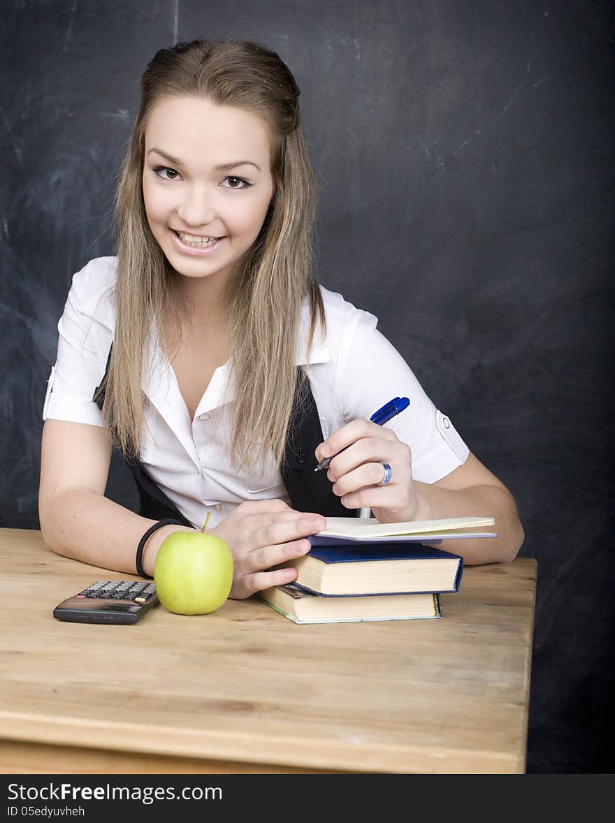 Cute Young Student Near Blackboard With Copy Book Calculator Pen, Copy Space