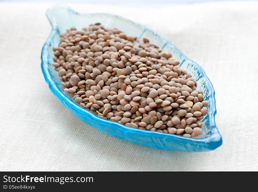 Brown lentils in a leaf-shaped plate