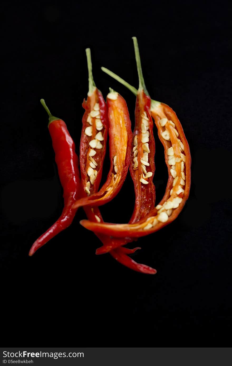 Chillies on black background