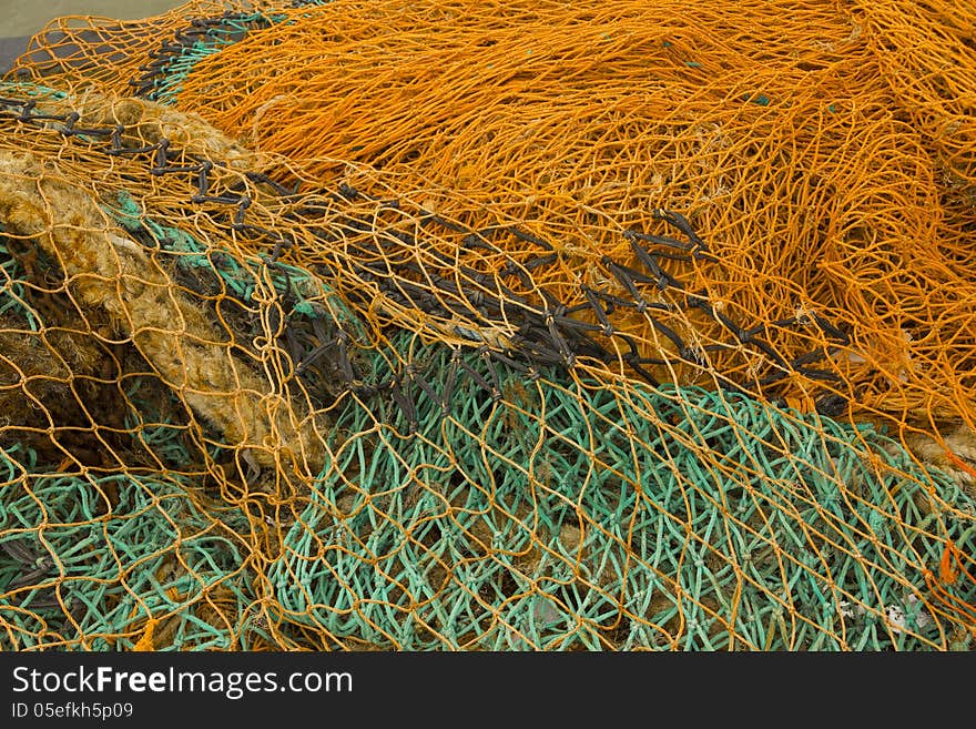 Close up of vibrant fishing nets used in local harbour