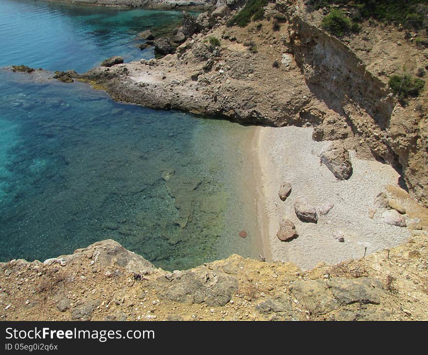 Empty, small beach hidden among big rocks, Thassos Island, Greece. Empty, small beach hidden among big rocks, Thassos Island, Greece