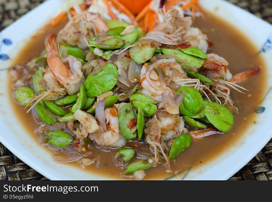 Fried Parkia with shrimp and source.