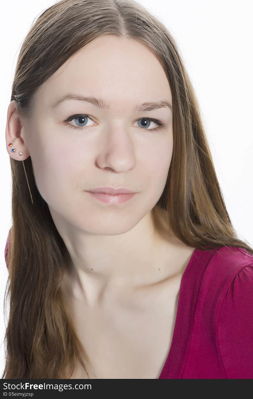 Close up portrait of young natural face, blue eyes teenager girl with long brown hair, looking straight to the camera. Isolated over white background. Close up portrait of young natural face, blue eyes teenager girl with long brown hair, looking straight to the camera. Isolated over white background.