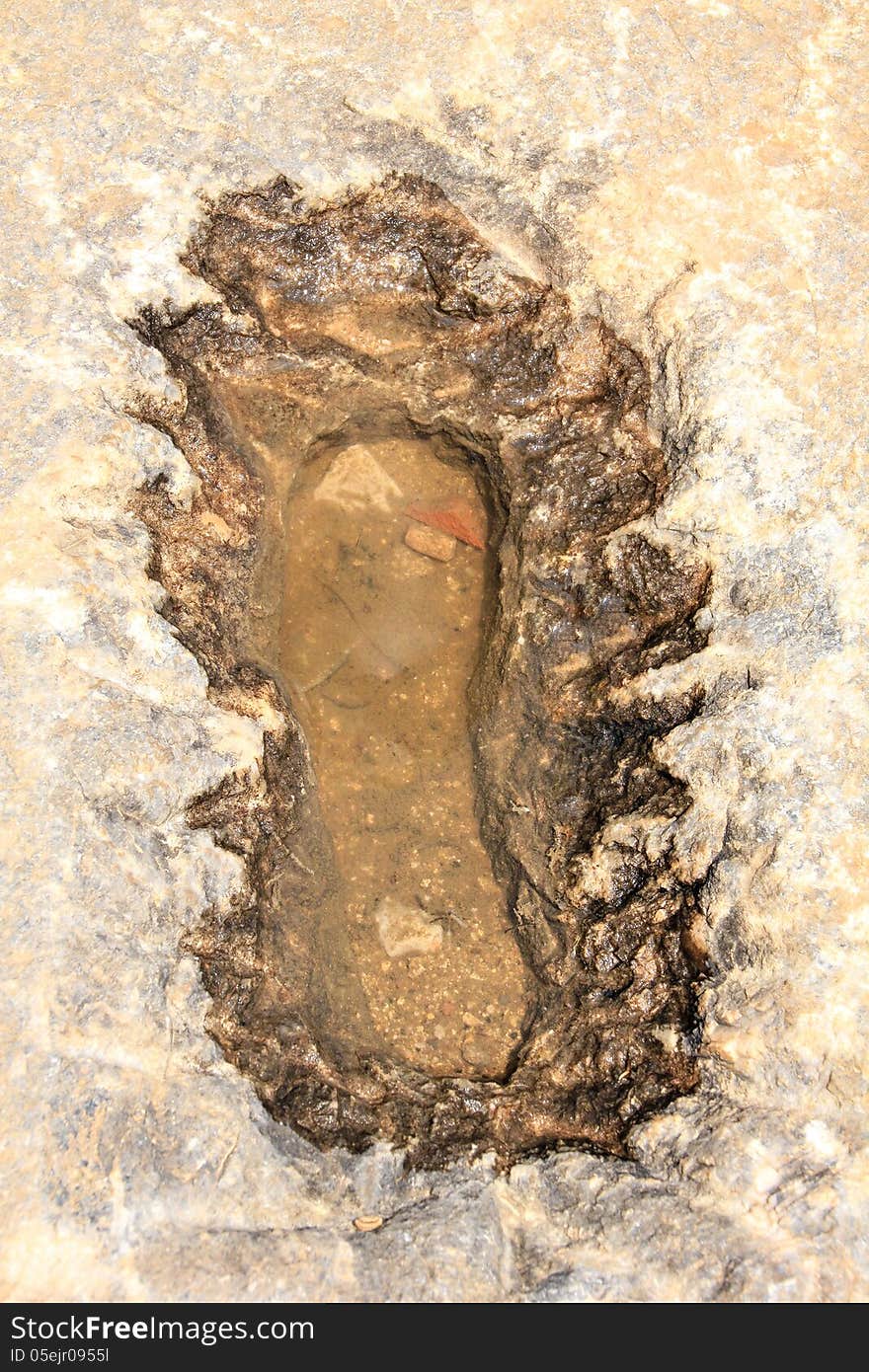 Single foot print in the old stone of Acropolis, Lindos, Rhodes