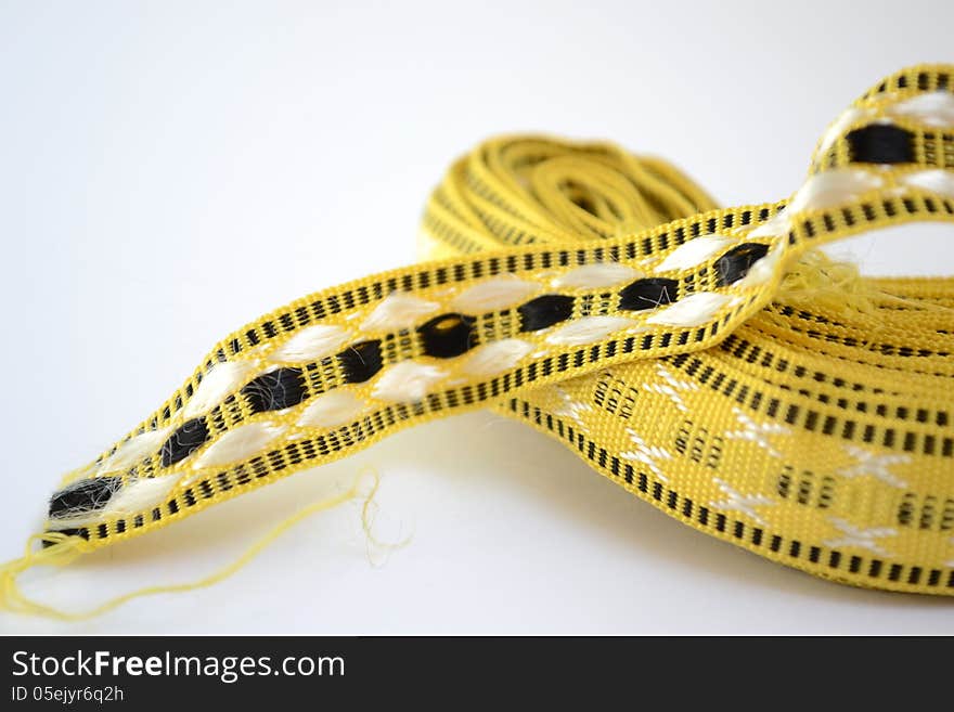 Skein of yellow tape for decoration. Skein of yellow tape for decoration