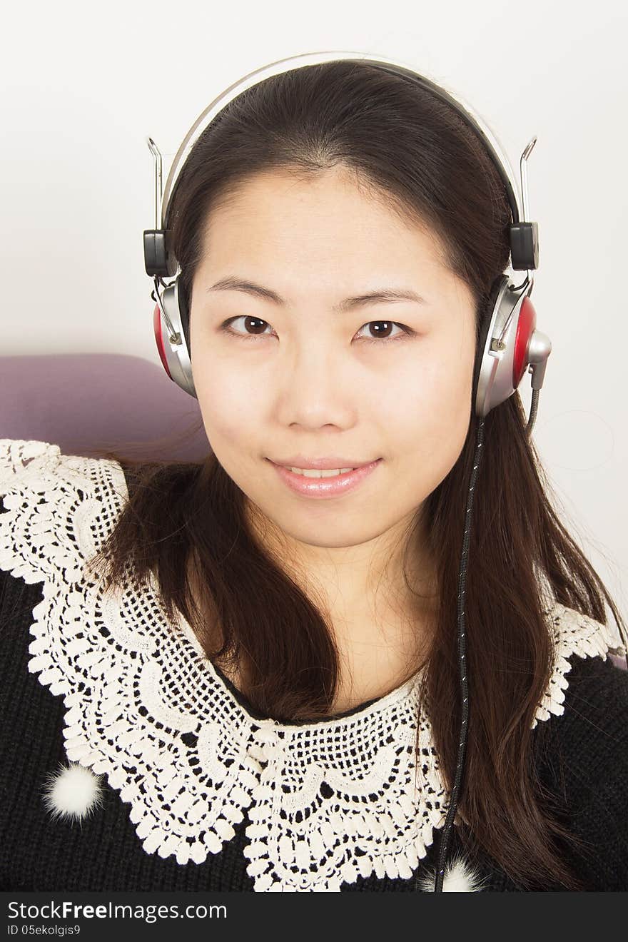 Close-up girl listening to music. Close-up girl listening to music.