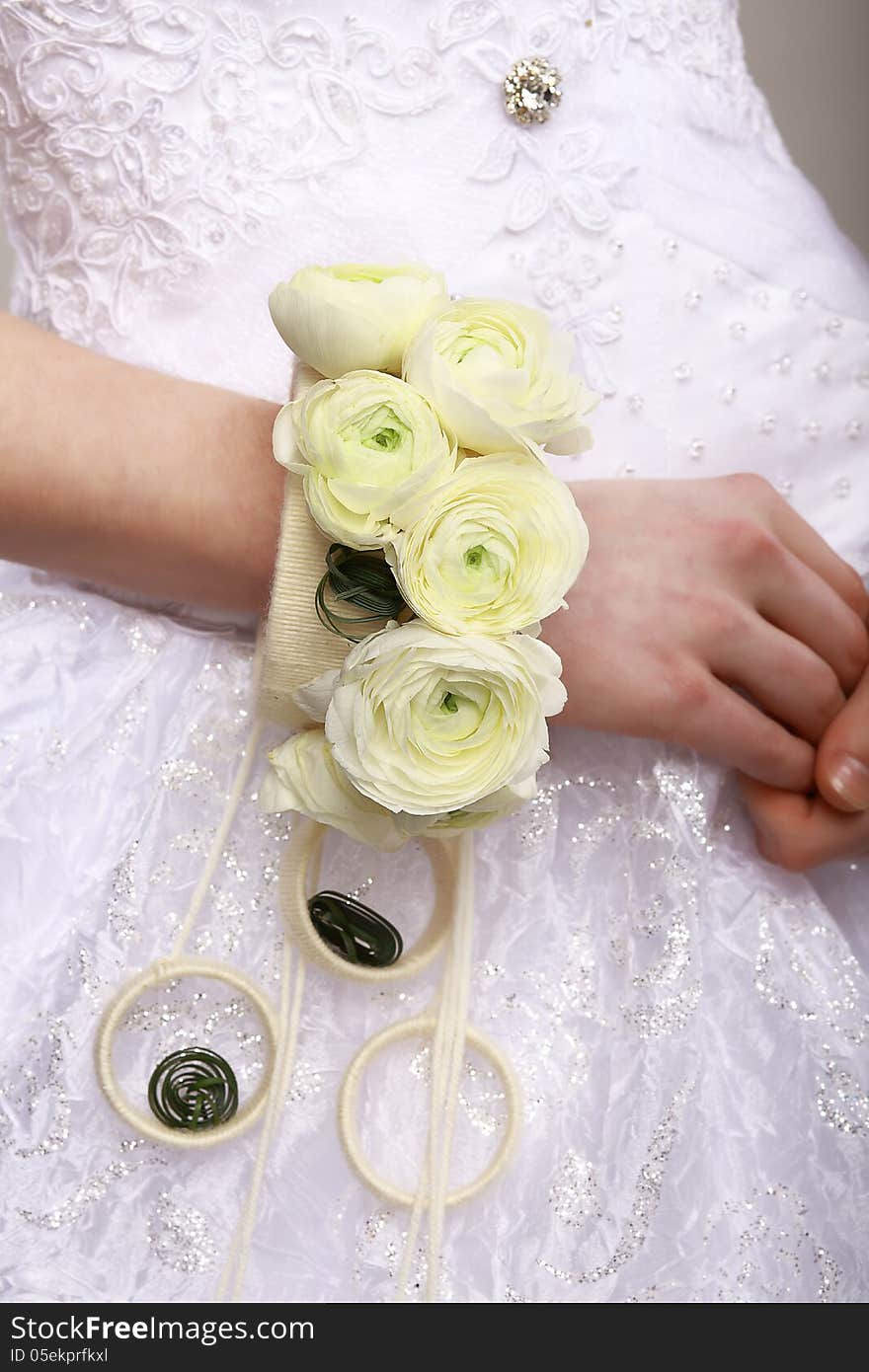 Arrangement. Bouquet of Flowers as a Bracelet on Woman&#x27;s Hands. Floristics