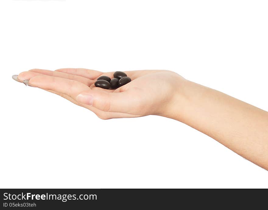 Woman holding a capsule close-up. Woman holding a capsule close-up