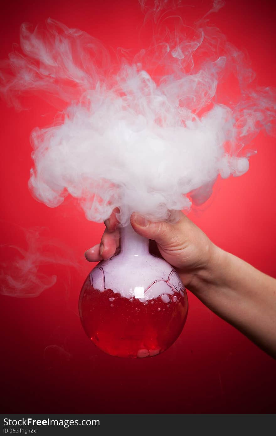 Steaming flask with red liquid