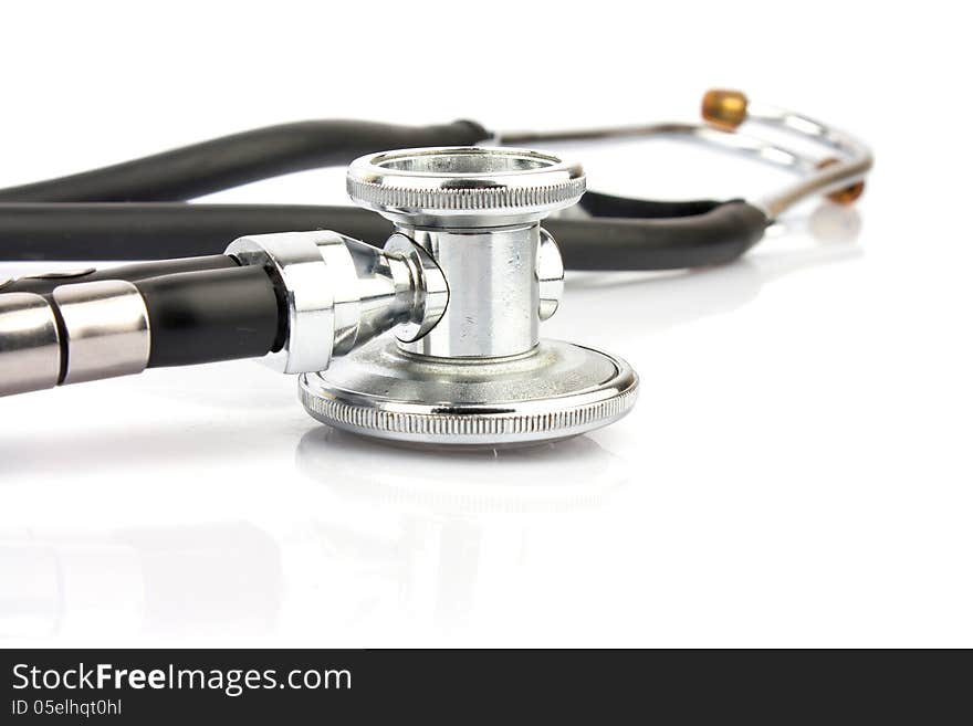 Metallic stethoscope on white background, medical equipment photo