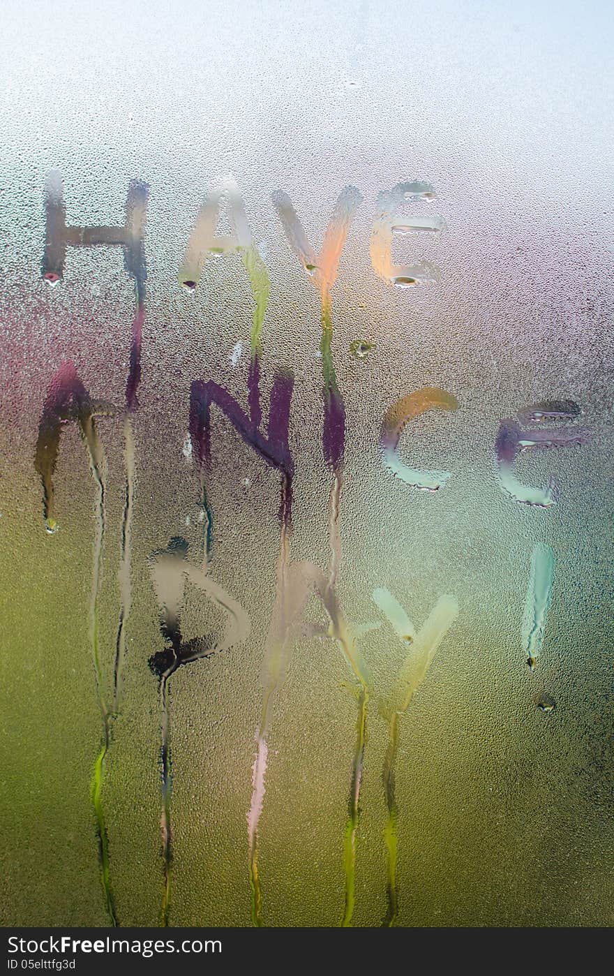 Have a Nice Day text handwritten on a misted window