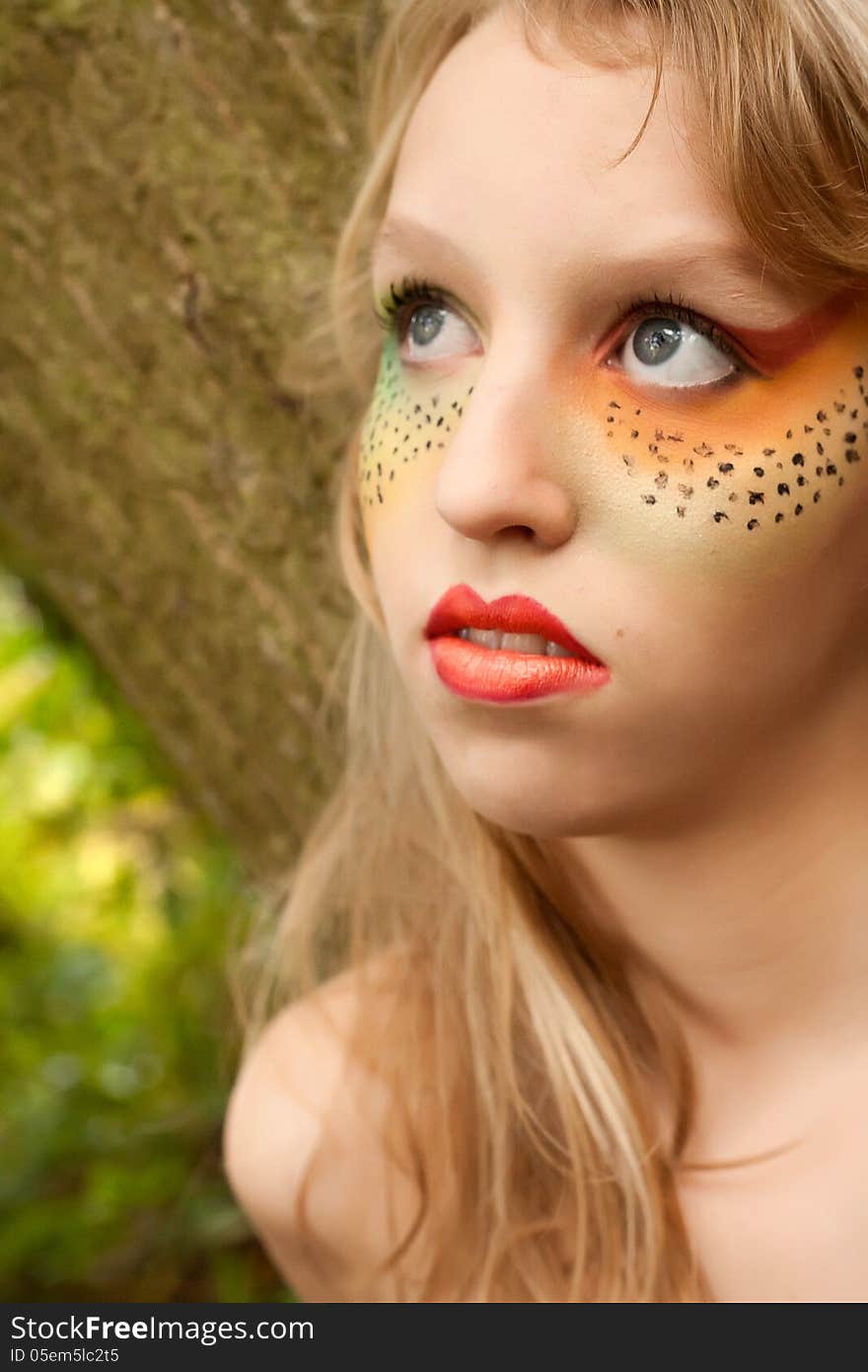 Happy teenager in a forest in the autumn. Happy teenager in a forest in the autumn