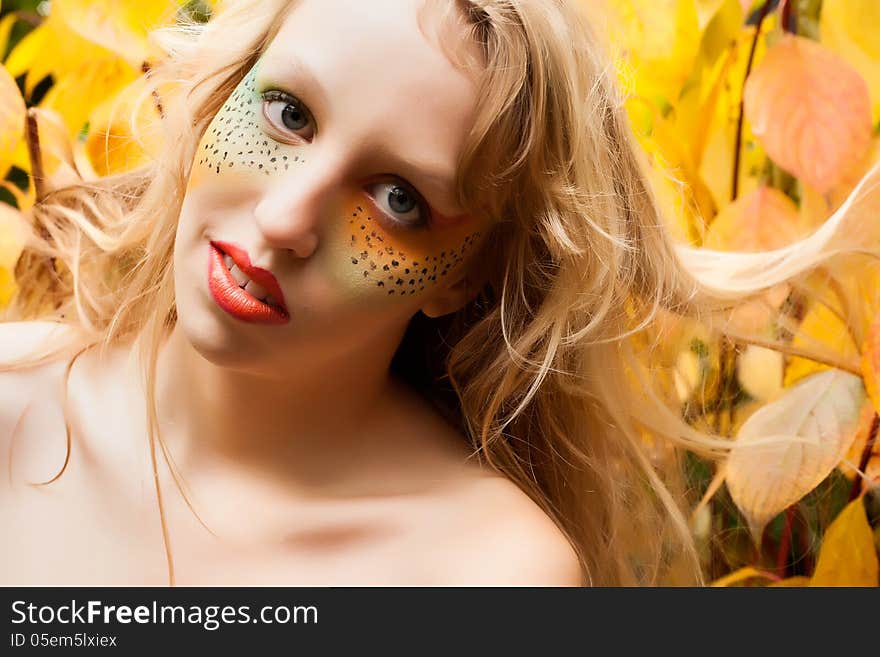 Happy teenager in a forest in the autumn. Happy teenager in a forest in the autumn