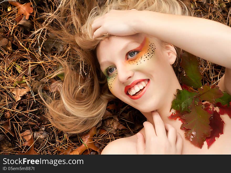 Happy teenager in a forest in the autumn. Happy teenager in a forest in the autumn