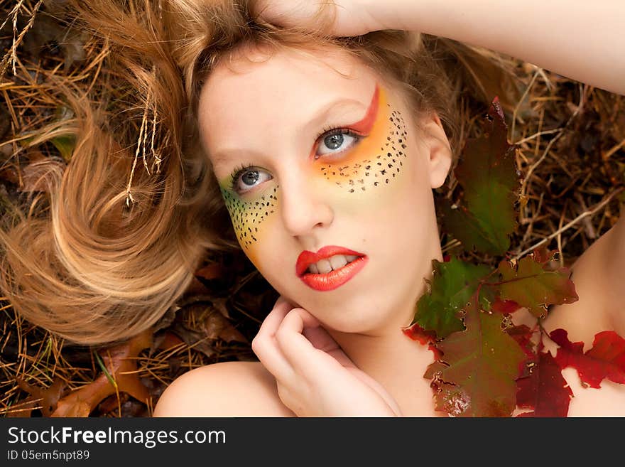 Happy teenager in a forest in the autumn. Happy teenager in a forest in the autumn