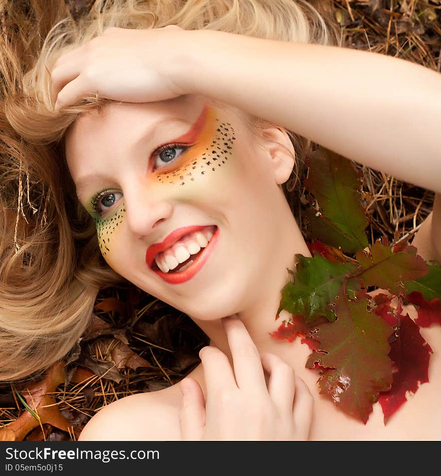 Happy teenager in a forest in the autumn. Happy teenager in a forest in the autumn