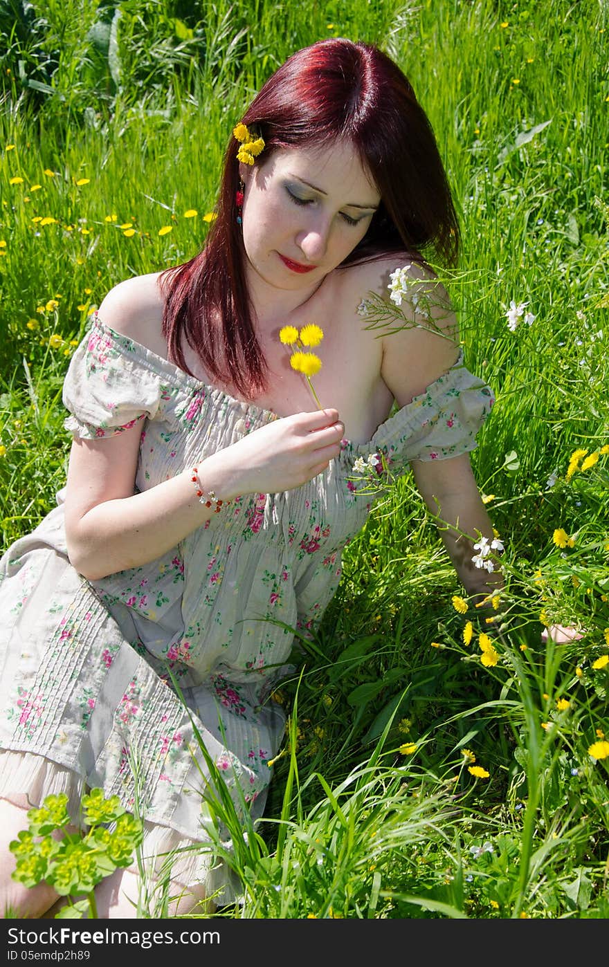 European woman sitting in the garden