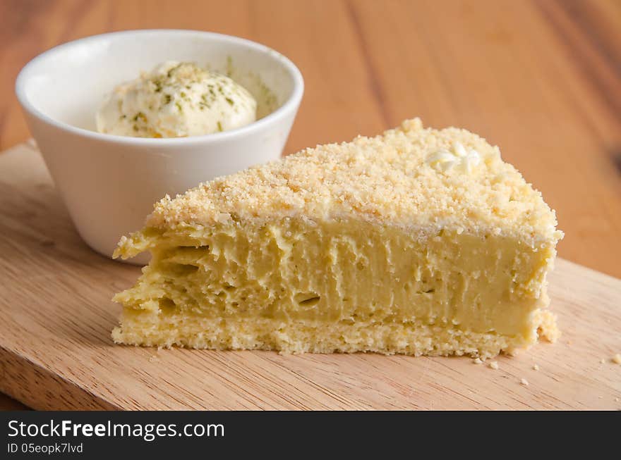 Potato Cake with cream on a wooden plate