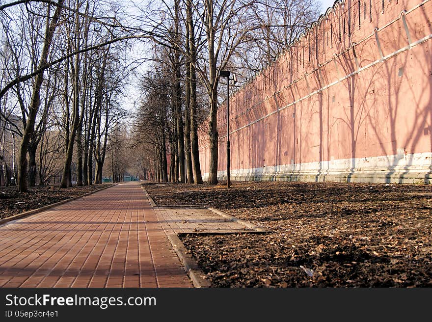 The fortress wall of the monastery in the old part of the city of Moscow